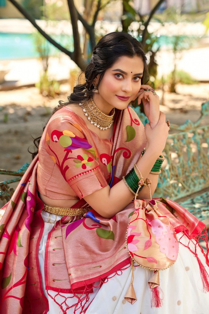 Traditional white Paithani lehenga with jacquard silk weaving, complemented by a stunning dupatta and batwa for cultural events.