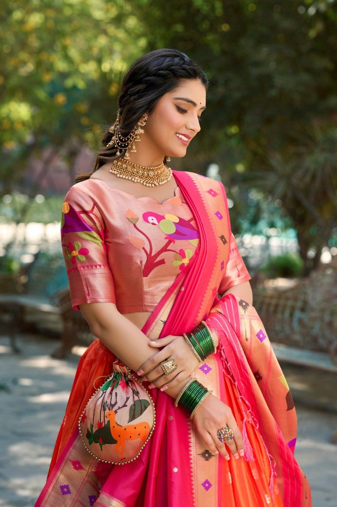 Gorgeous orange Paithani lehenga with jacquard silk fabric, adorned with a luxurious dupatta and batwa for festive occasions.