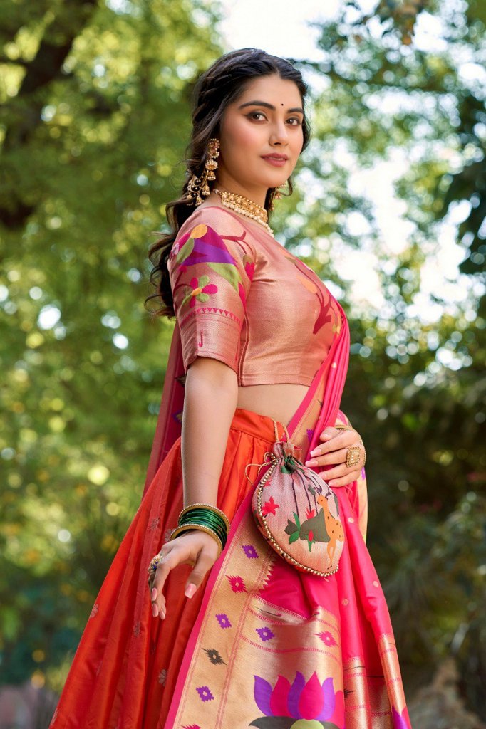 Traditional orange Paithani lehenga set with jacquard silk weaving, complemented by an elegant dupatta and batwa.