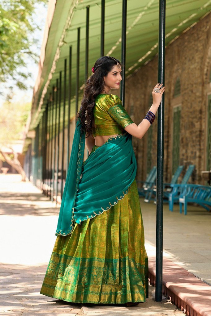 Traditional green Kanjivaram Lehenga with a customizable blouse and intricate dupatta embroidery, designed for elegant celebrations in the USA.