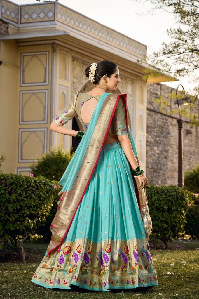 Stunning sky-blue jacquard silk lehenga with detailed zari work and a perfectly matched blouse for weddings.