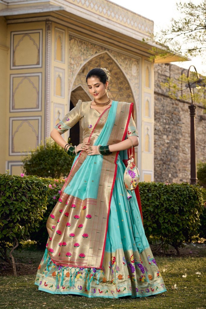 Elegant sky-blue jacquard silk lehenga set featuring intricate zari work and a matching blouse for festive wear.