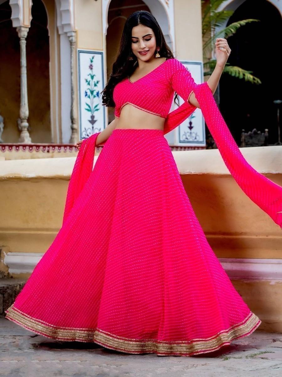 Pink georgette lehenga choli with Laheriya print for women.