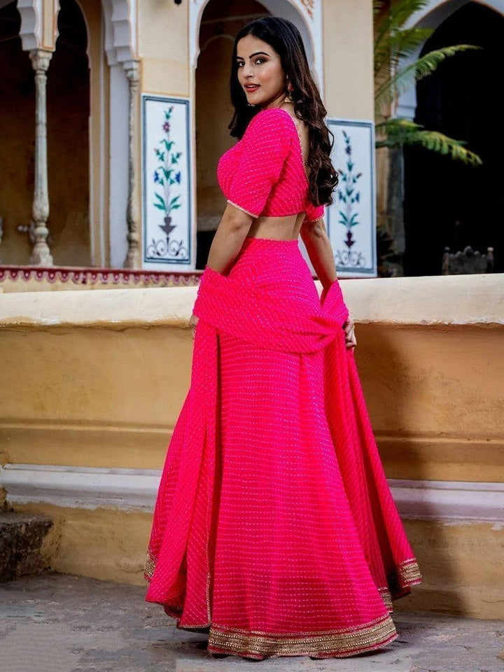 Semi-stitched pink lehenga choli for women with unstitched material.