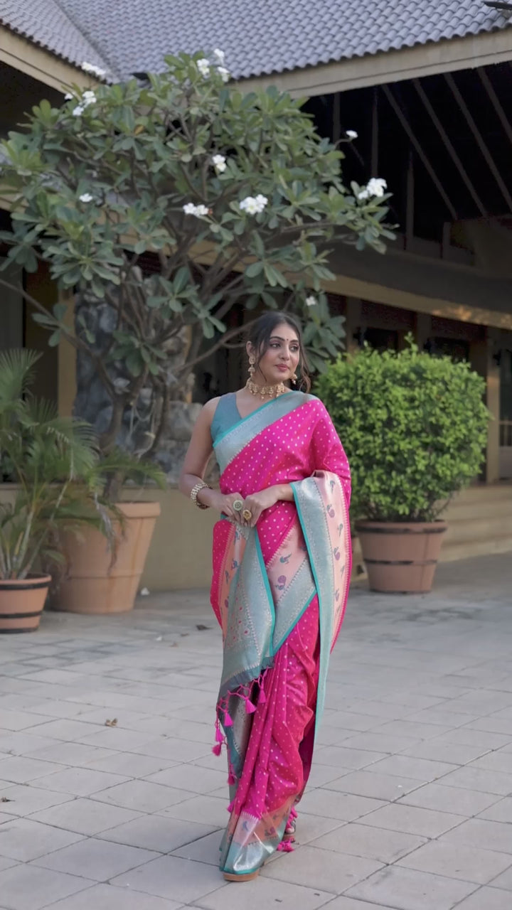 Bright pink Indian wedding saree featuring Banarasi silk, peacock border, and zari pallu. Add elegance to your special occasion with this stunning piece.