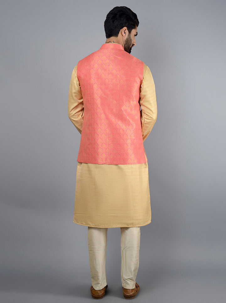 This rose pink Jodhpuri jacket features concealed buttons, pockets, and elegant embroidery, ideal for traditional celebrations.