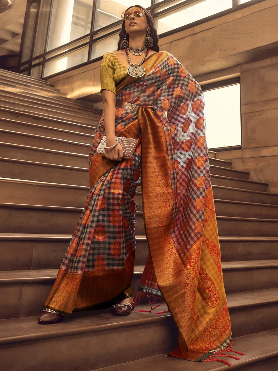 Orange luxurious fabric saree crafted for elegance and style.