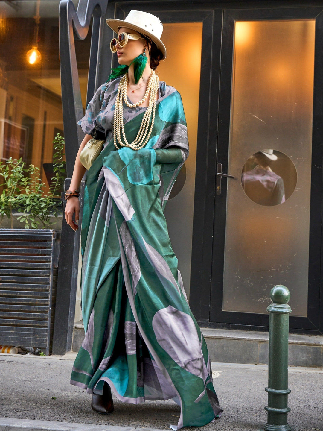 Green satin saree crafted for elegance and style.