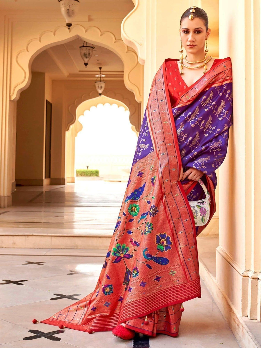 Red silk saree crafted for elegance and style.