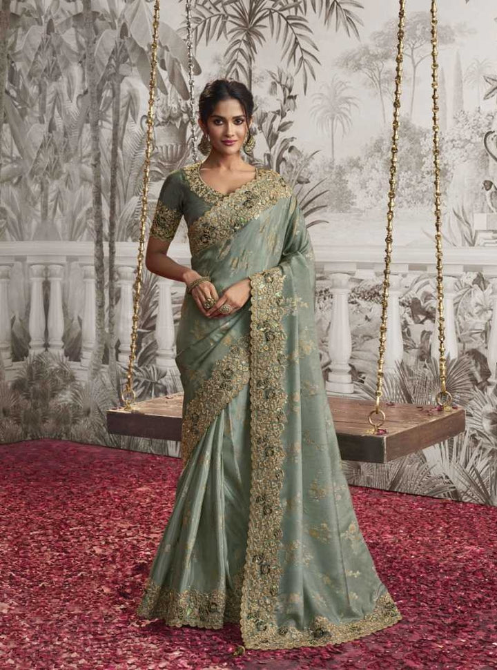 Pista Green Dola Silk Saree | Elegant Zari Embroidery with Delicate Latkan