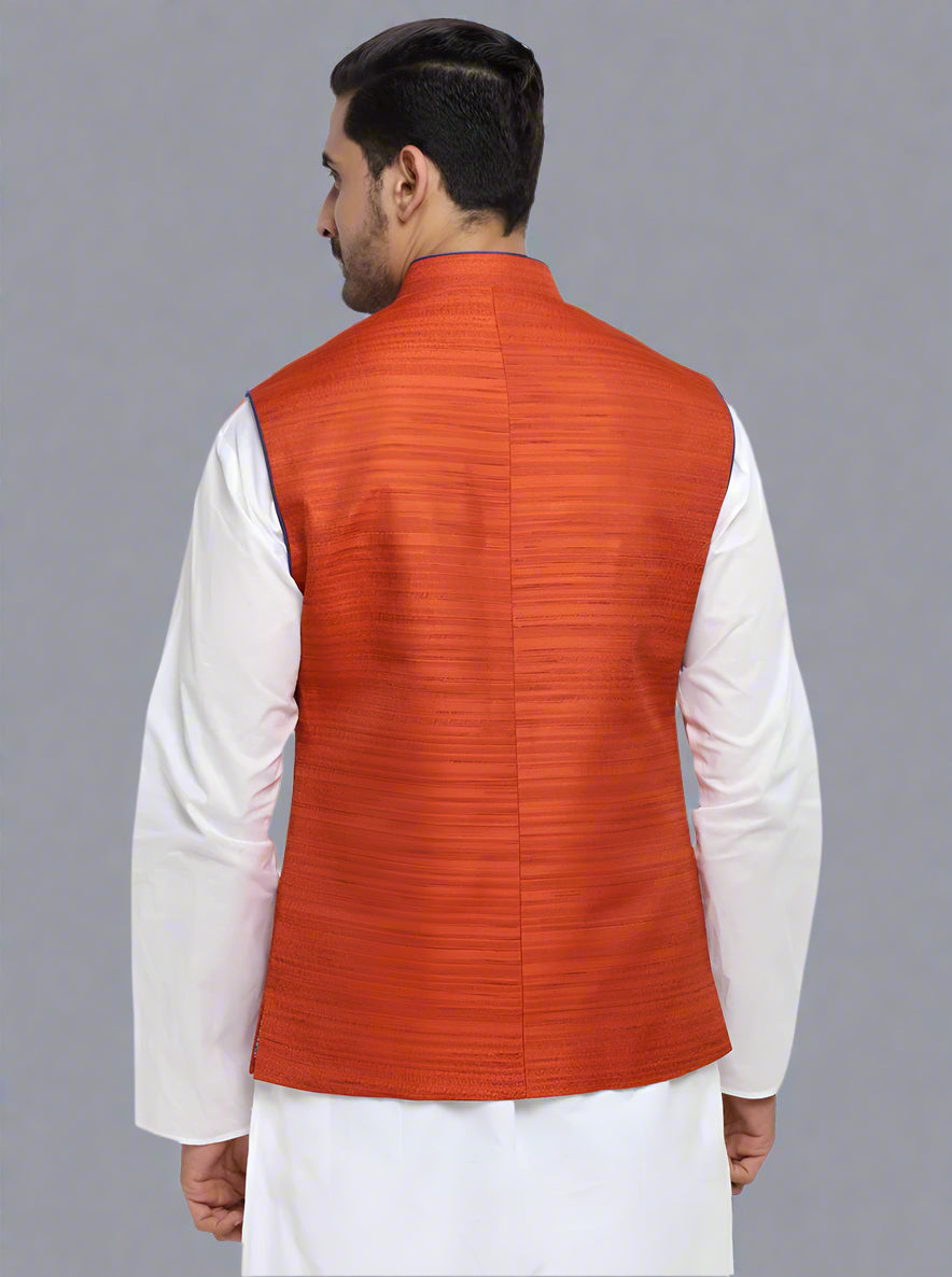 Stylish self-textured rust waistcoat crafted from silk blend, designed for comfort and sophistication at gatherings.