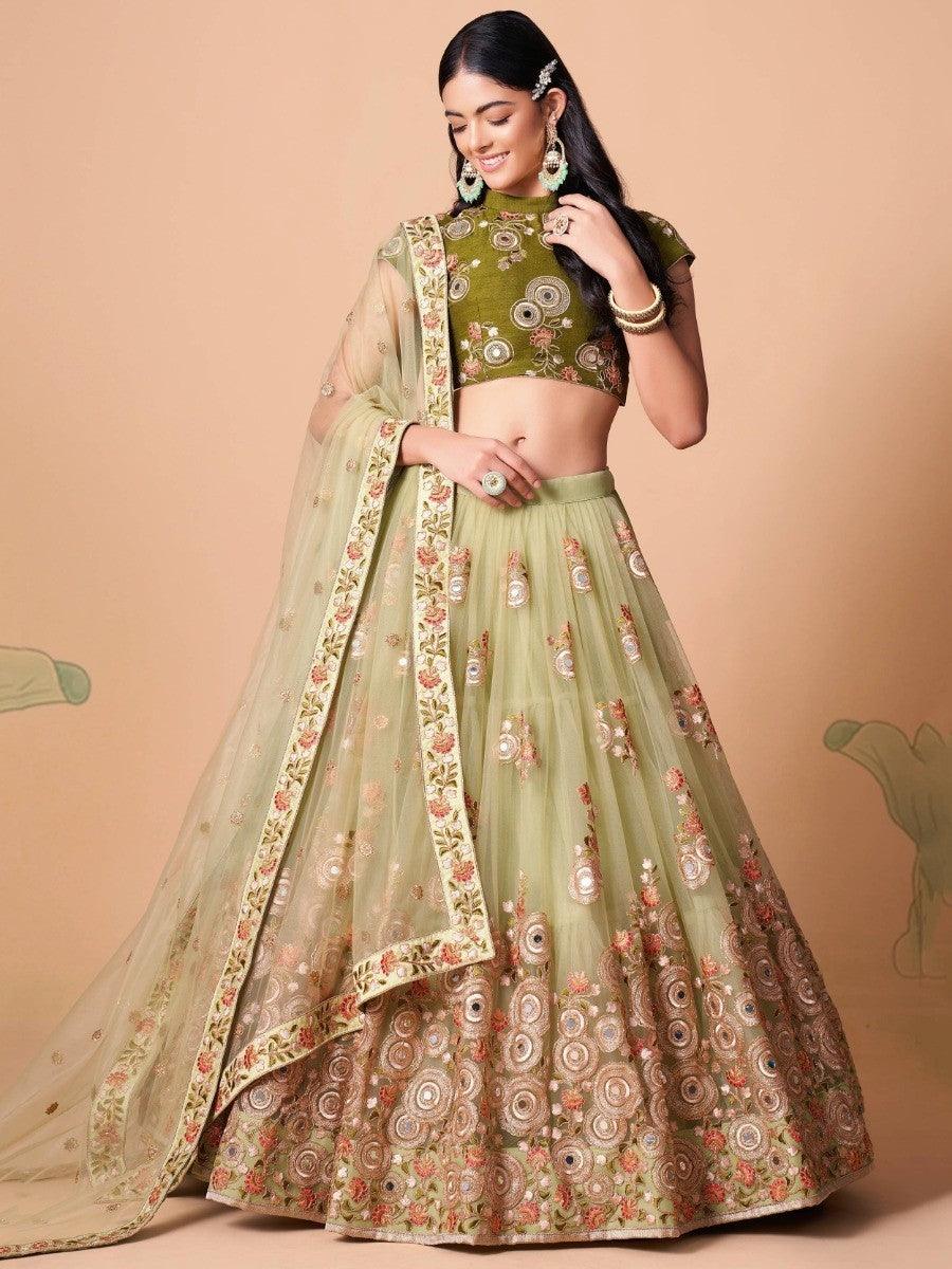 Elegant pastel green net lehenga with embroidery and sequin work.