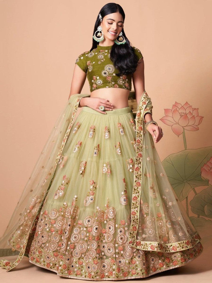 Beautiful party wear lehenga choli in pastel green with mirror work.