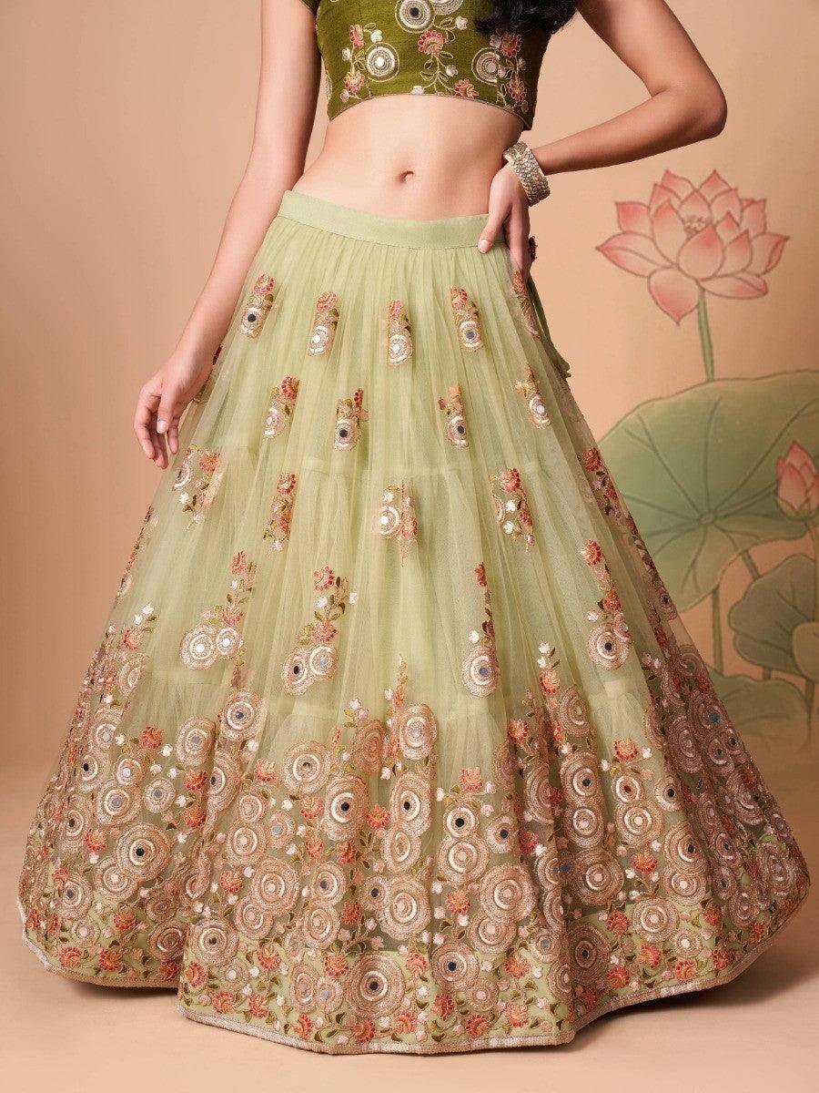 Unique pastel green lehenga for women with embroidery and mirror work.