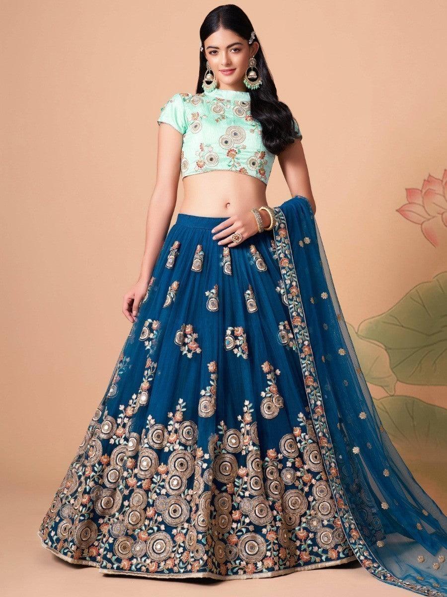 Elegant dove blue lehenga with mirror work and sequin detailing.