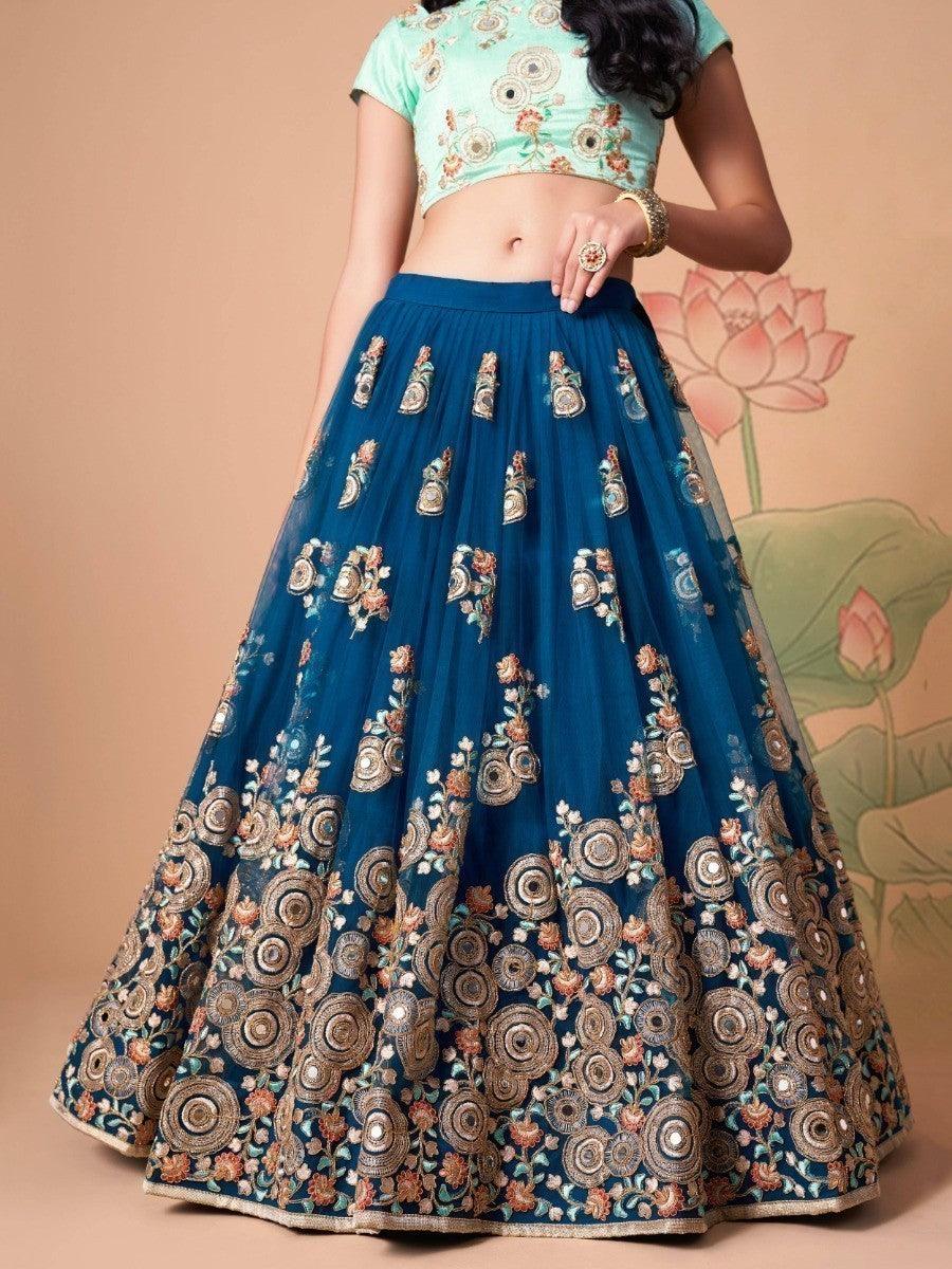 Party wear lehenga choli in dove blue with traditional touches.