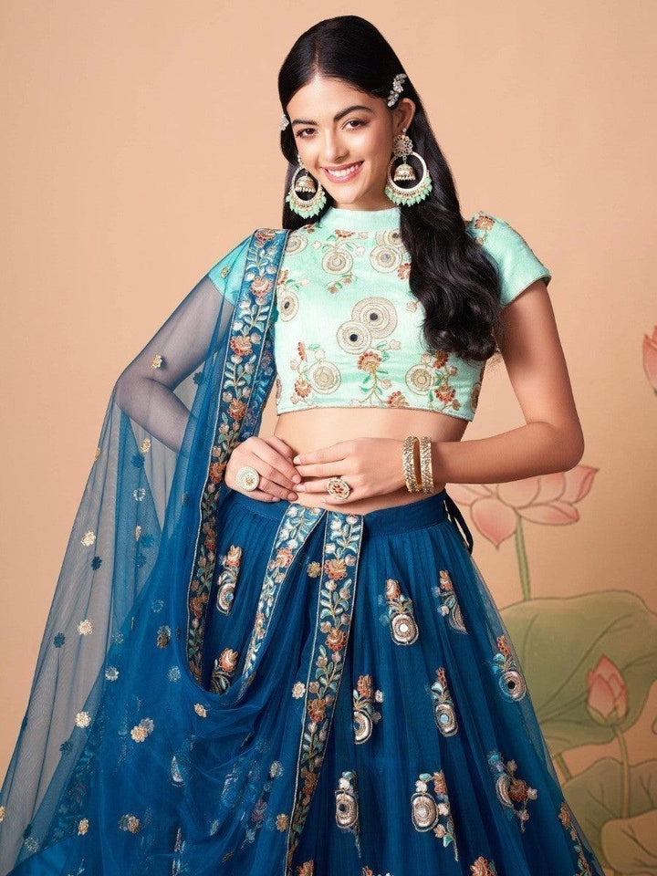 Semi-stitched dove blue lehenga choli with intricate embroidery.