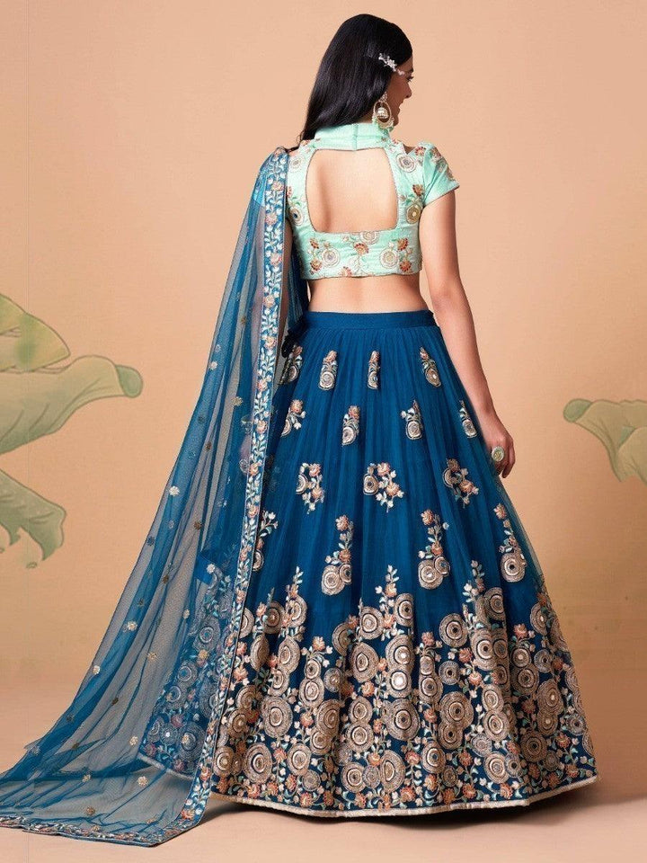 Sky blue choli and dove blue net dupatta with mirror work.