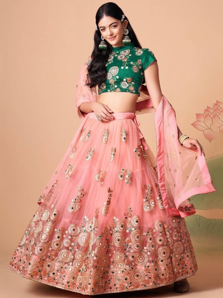 Elegant peach lehenga with embroidered choli and sequins.