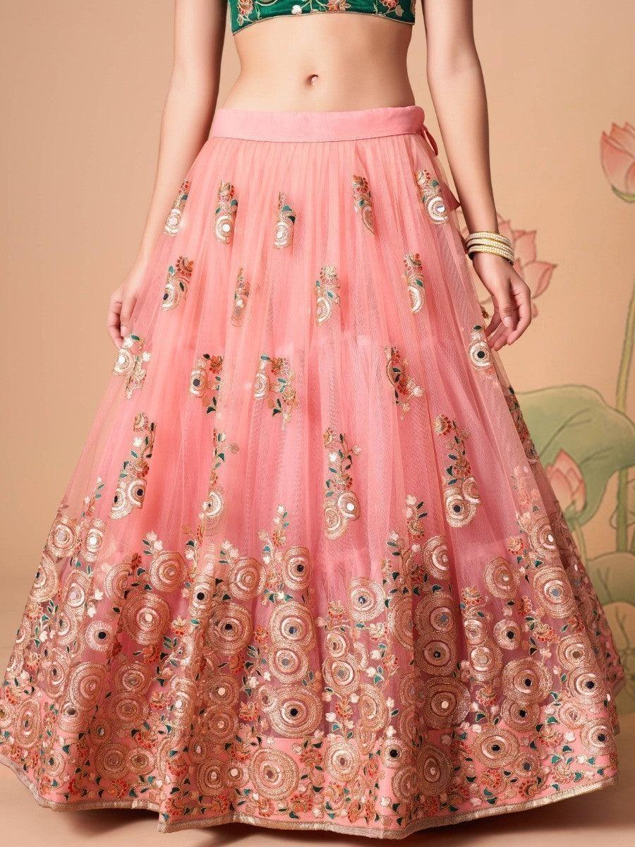 Mirror work peach lehenga choli set for festive wear.