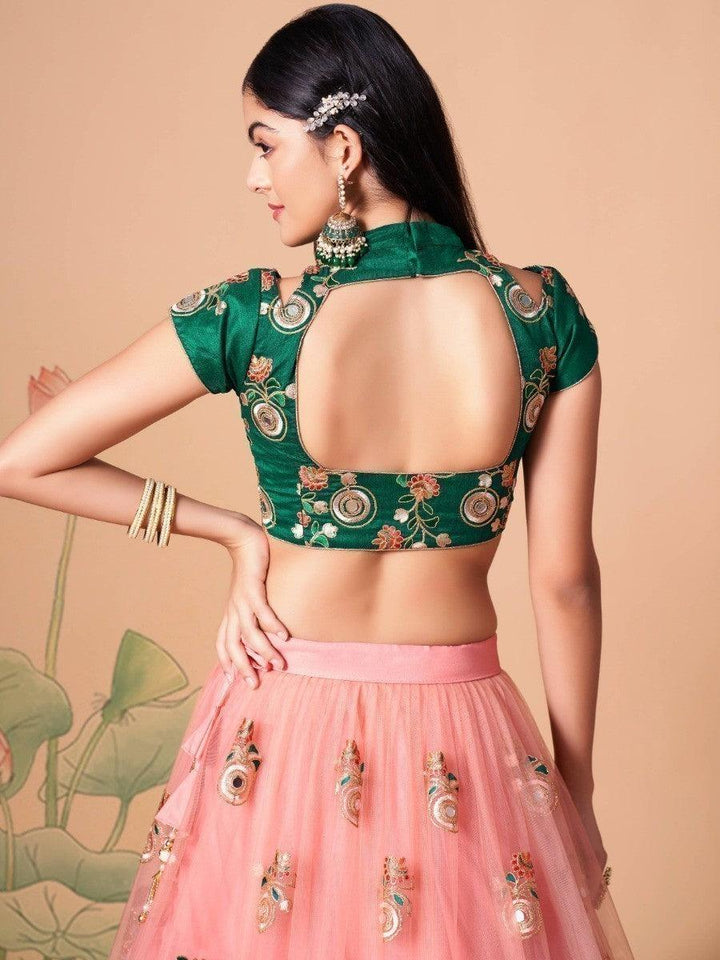 Traditional peach lehenga for weddings and ceremonies.