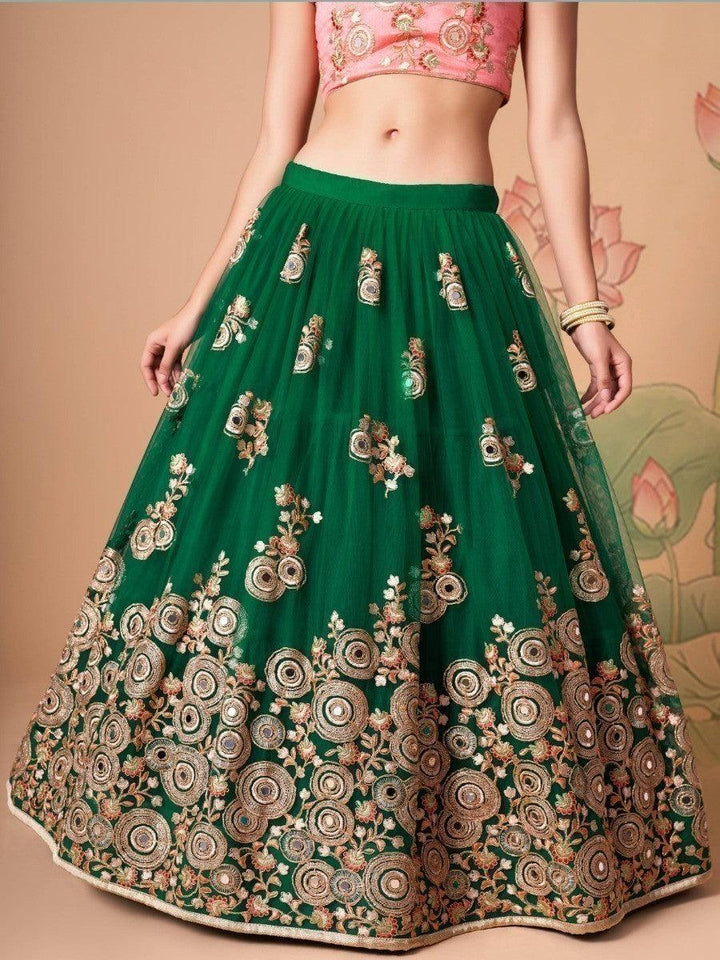 Bridal-ready green lehenga choli with mirror work and sequins.