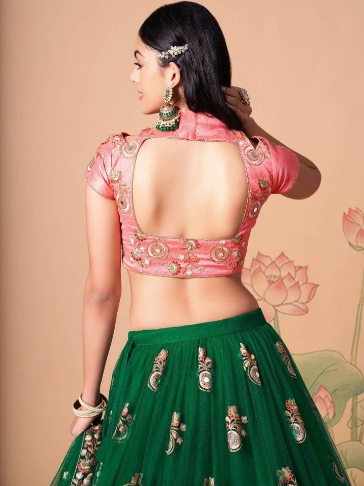 Beautiful green lehenga with pink dupatta and embroidery.