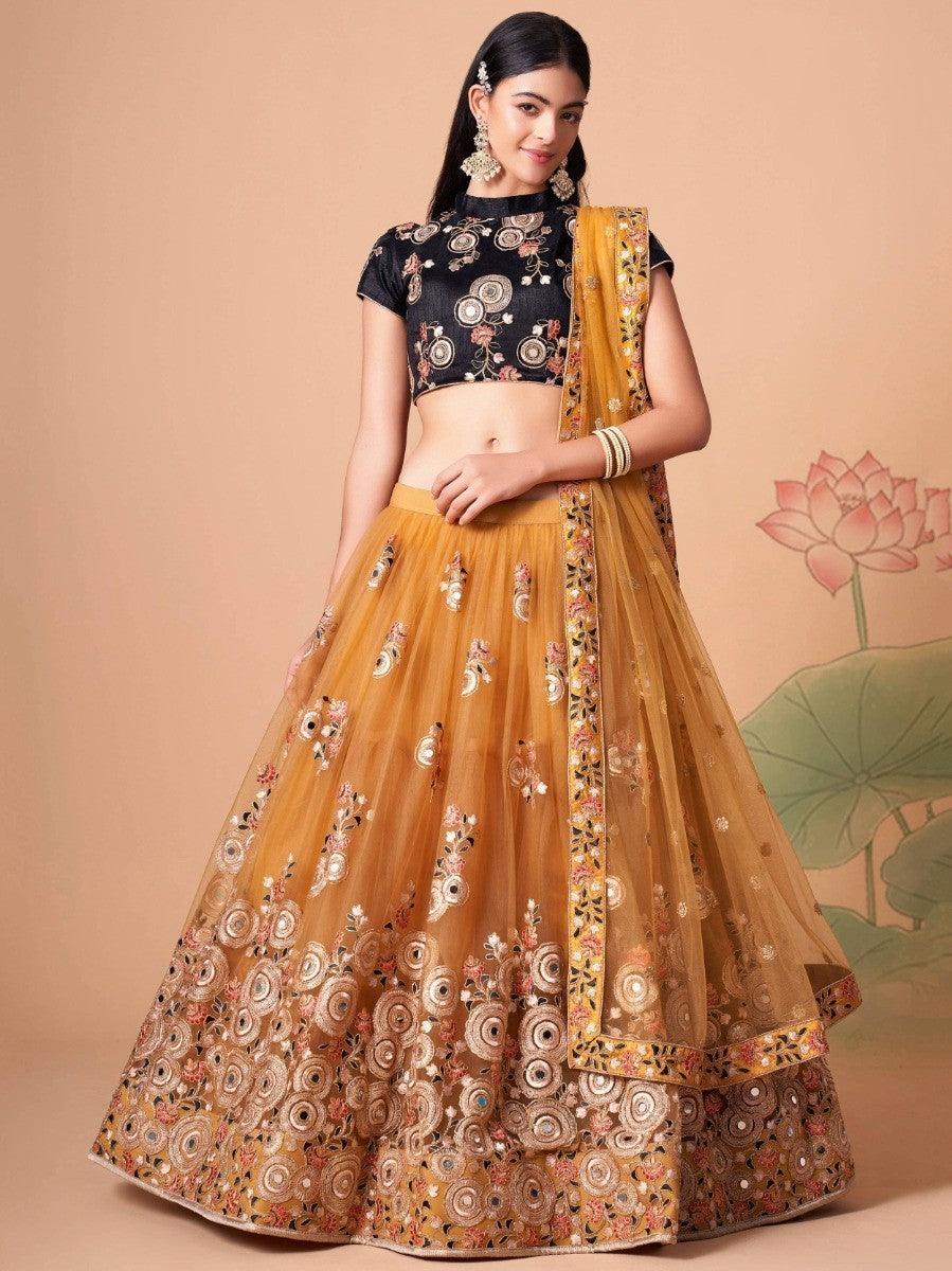 Gold net lehenga with mirror work, thread embroidery, and sequin details.