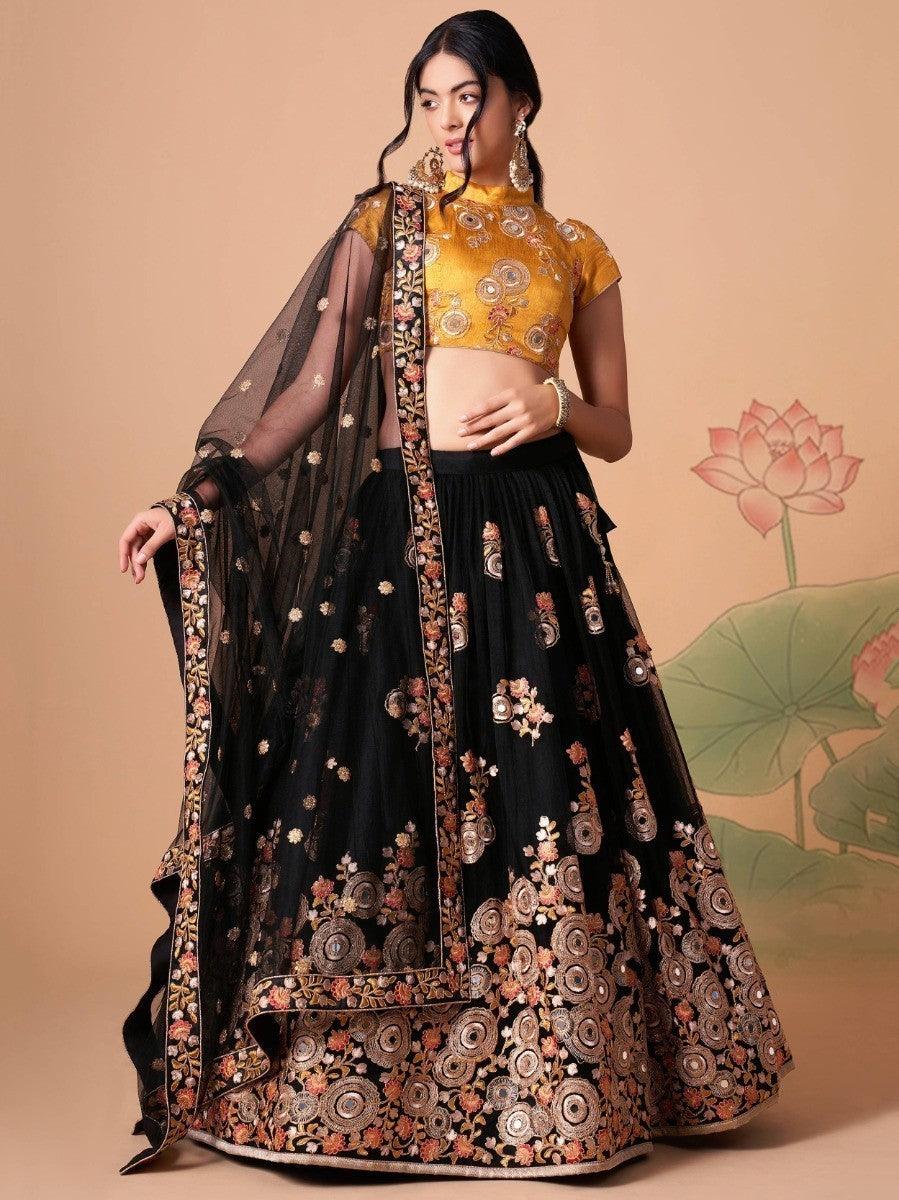 Black net lehenga with mirror work, thread embroidery, and sequin details.