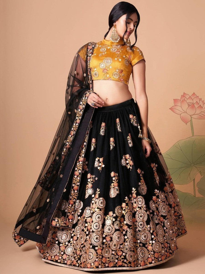 Elegant black lehenga with yellow art silk choli and embroidery.