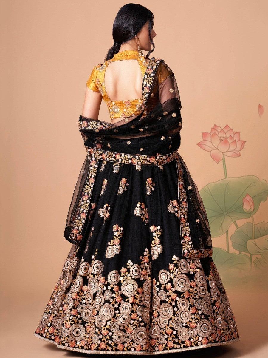 Bridal-ready black lehenga with mirror work and thread embroidery.