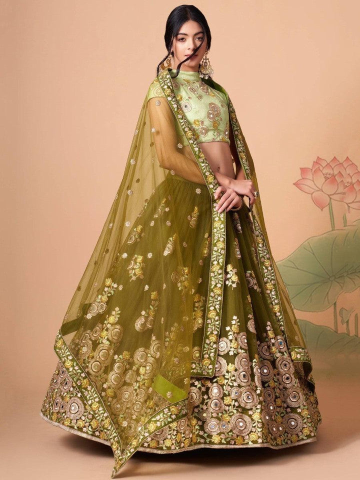 Traditional party wear lehenga in olive green with embroidery details.