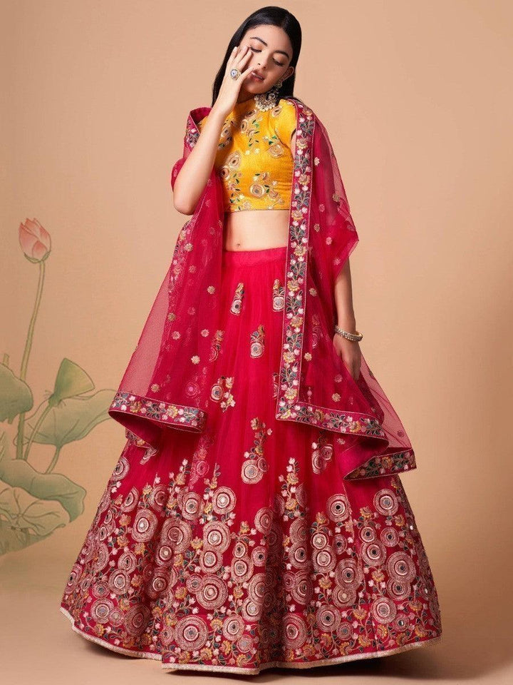 Bridal hot pink lehenga choli with thread and mirror embroidery.