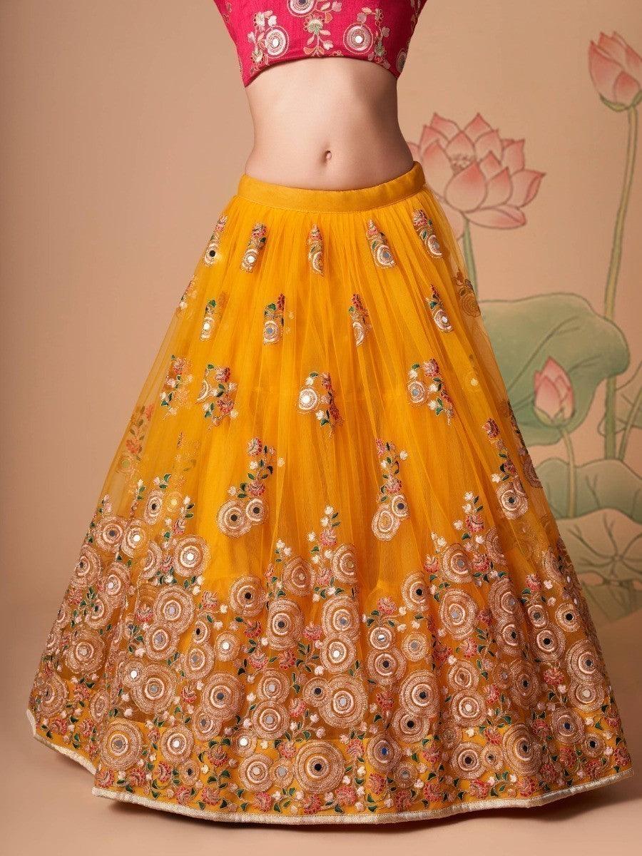 Yellow lehenga choli with art silk choli and detailed embroidery.