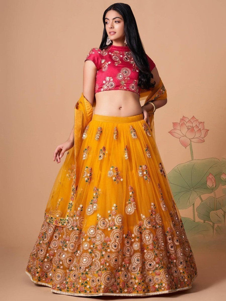 Yellow lehenga with mirror work and sequin embroidery details.