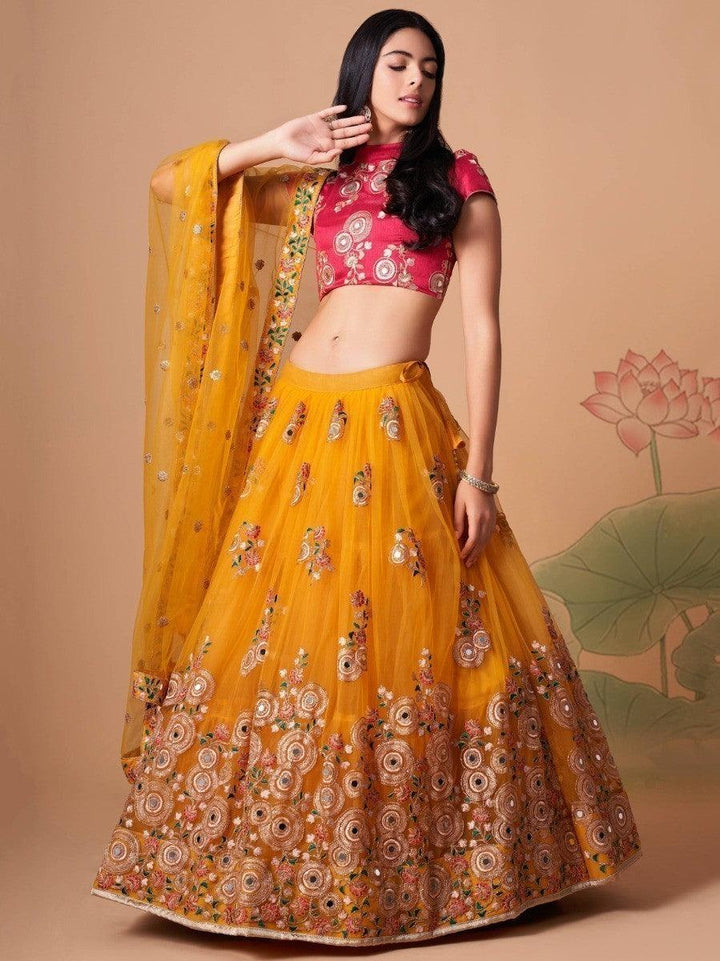 Bridal yellow lehenga choli with thread and mirror work.