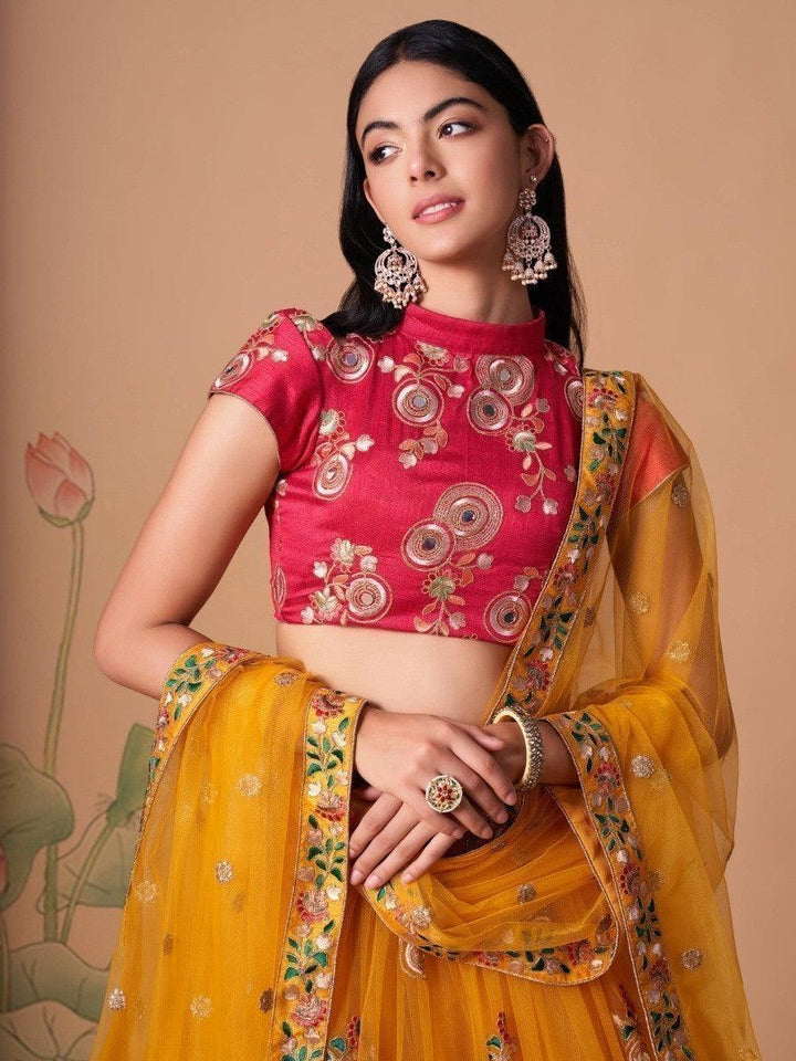 Semi-stitched yellow lehenga with intricate embroidery work.