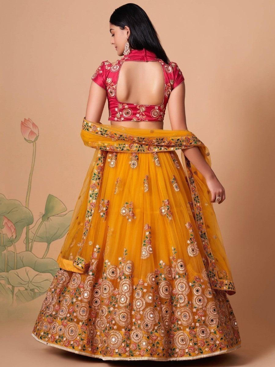 Yellow dupatta with thread embroidery and mirror accents.