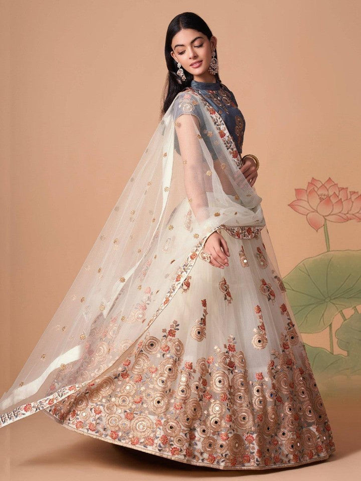 Traditional bridal off-white lehenga choli with thread embroidery.