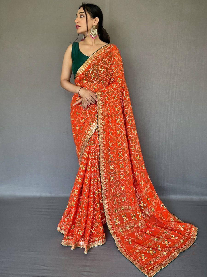 Orange georgette saree crafted for elegance and style.