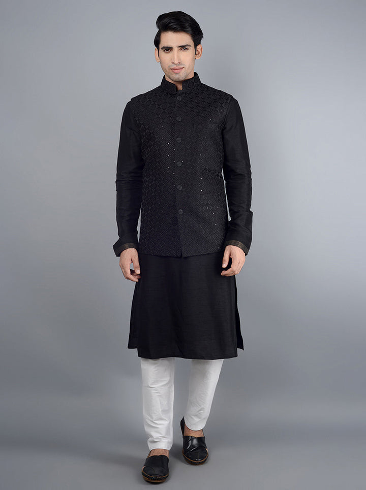 This elegant black bandhgala jacket showcases intricate embroidery and pockets, perfect for any formal event.