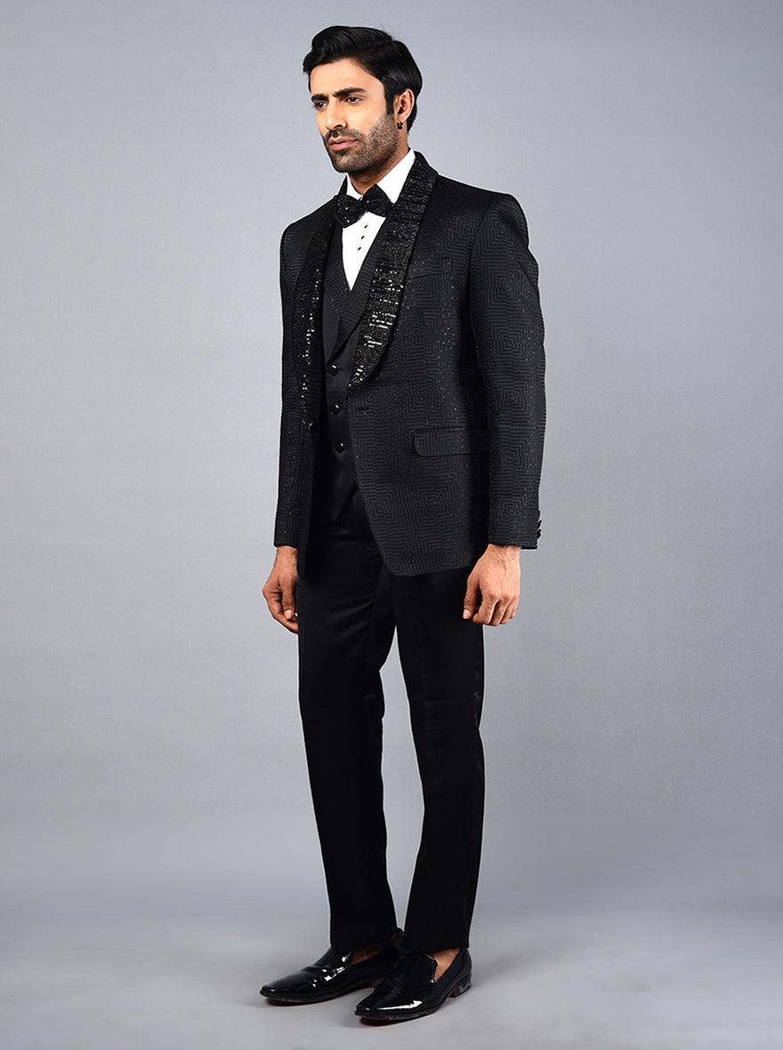 Modern black suit for men with intricate embroidery and a silk blend, ideal for weddings and special events.