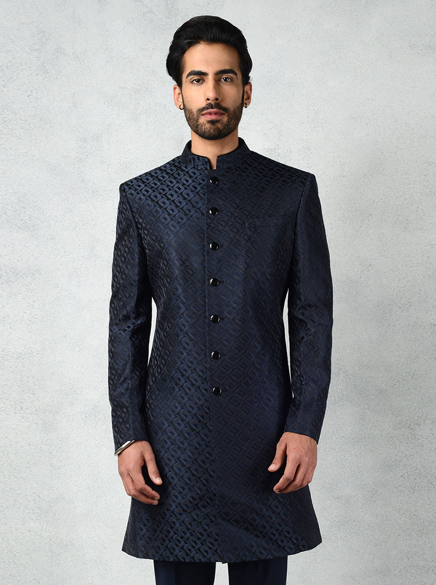 Stylish teal black Indo-Western for men, featuring jacquard fabric, mandarin collar, and slim fit black trousers.