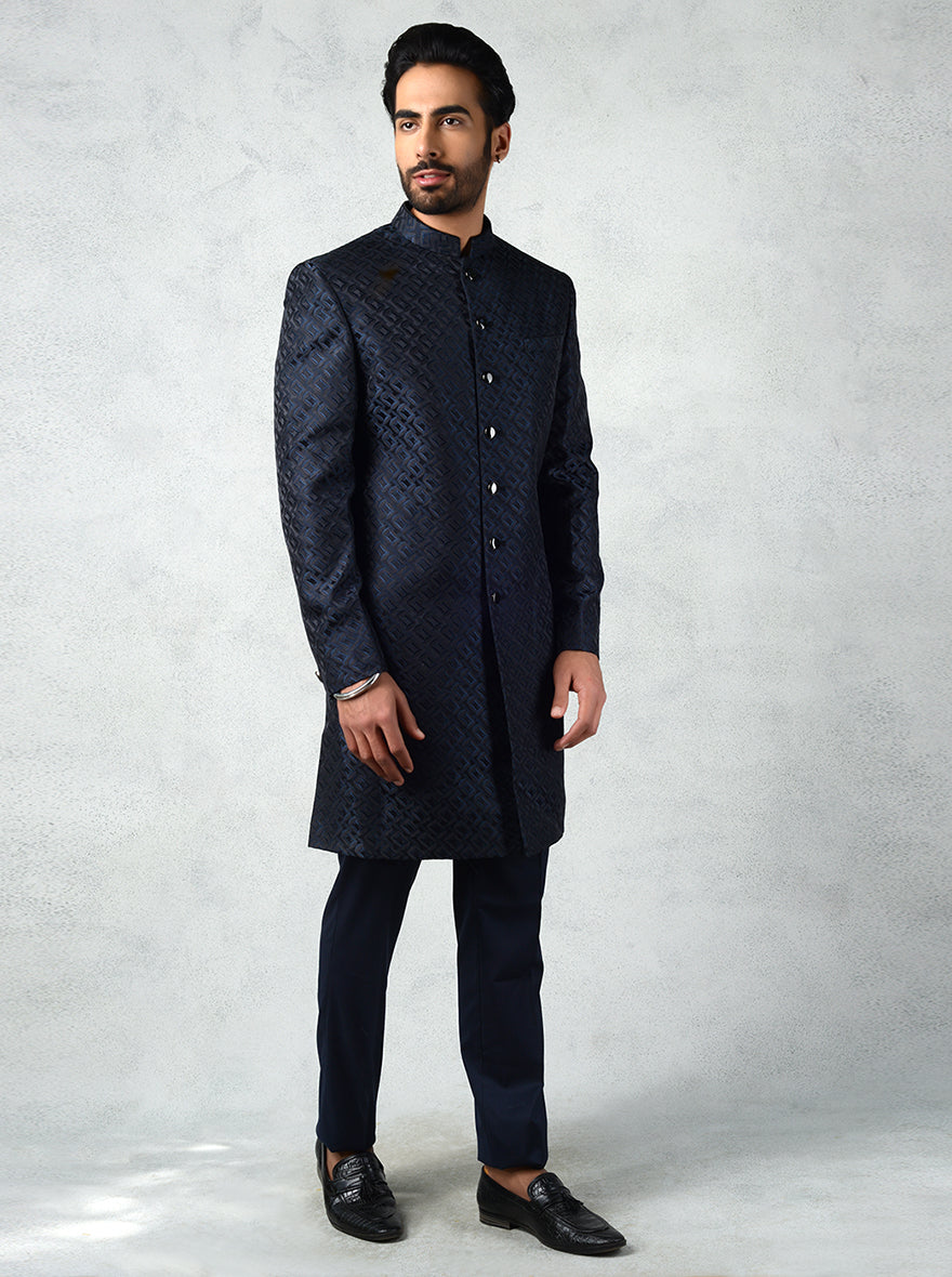 Men’s teal black Indo-Western outfit with mandarin collar, jacquard diagonal squares, and slim fit trousers.