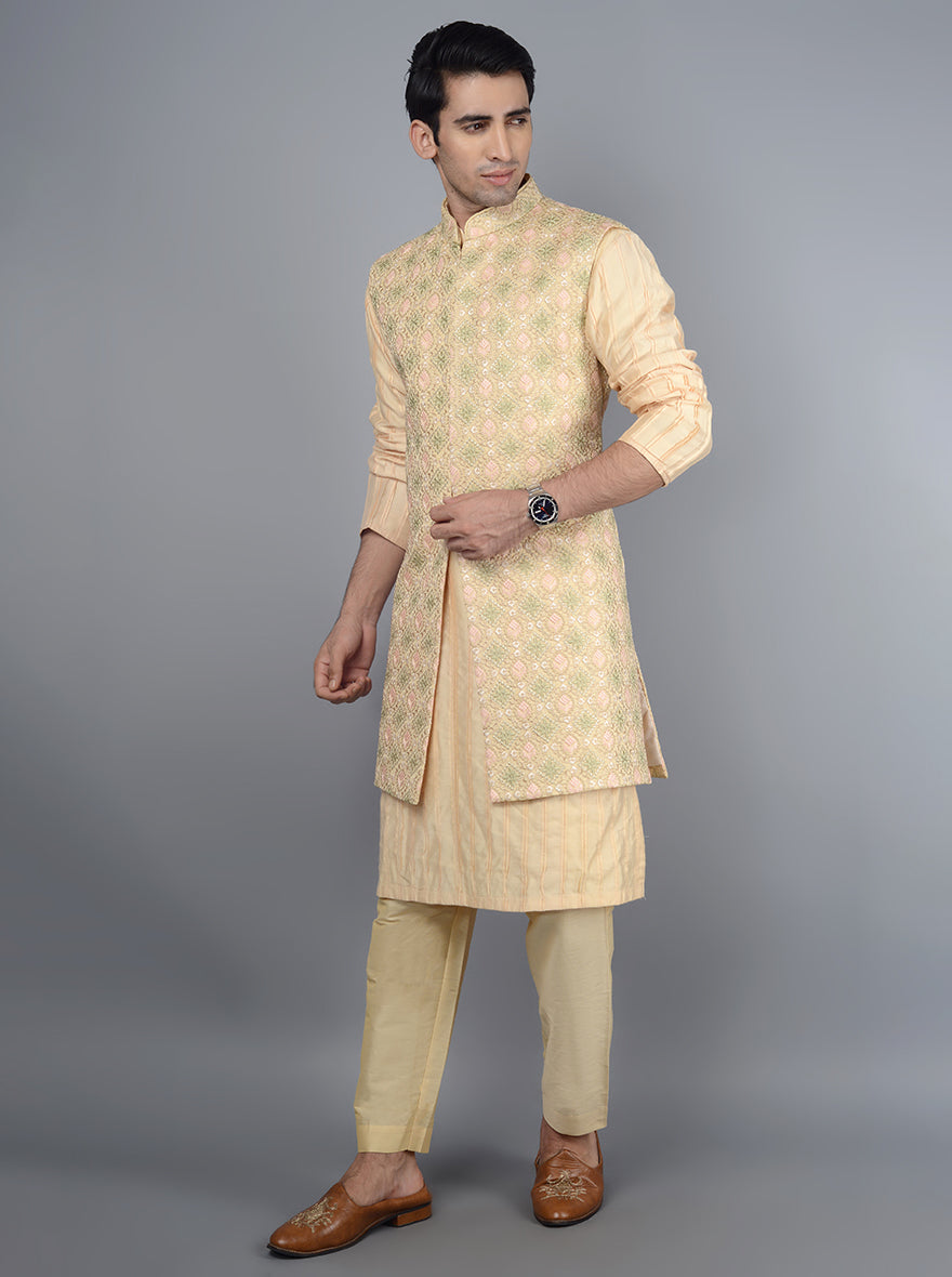 Sophisticated peach kurta pajama for stylish men.