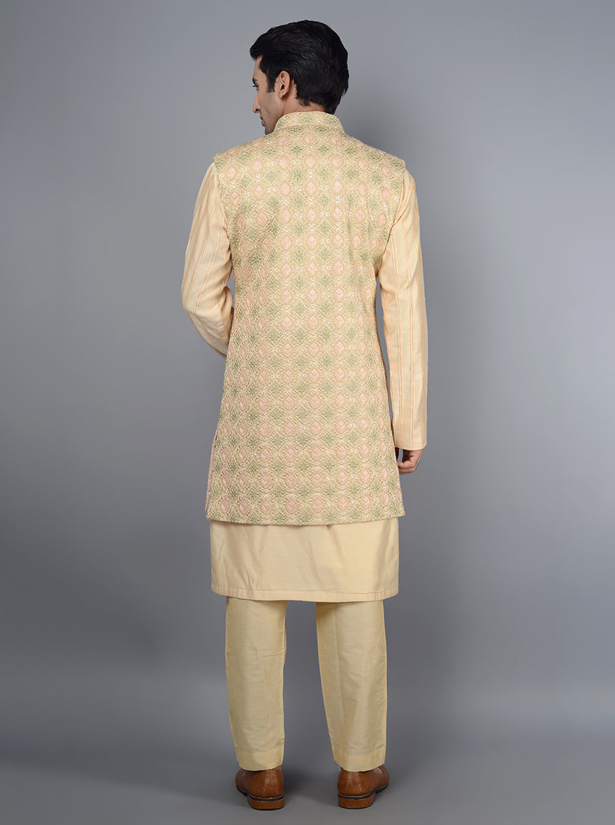 Luxurious peach kurta set ideal for cultural gatherings.