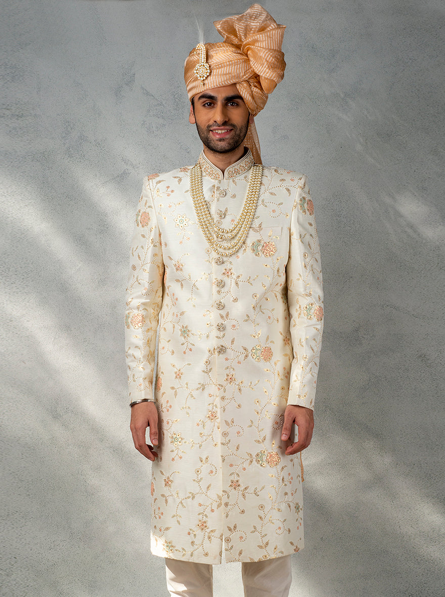 Experience timeless sophistication with our cream sherwani, perfect for a standout groom's ensemble.