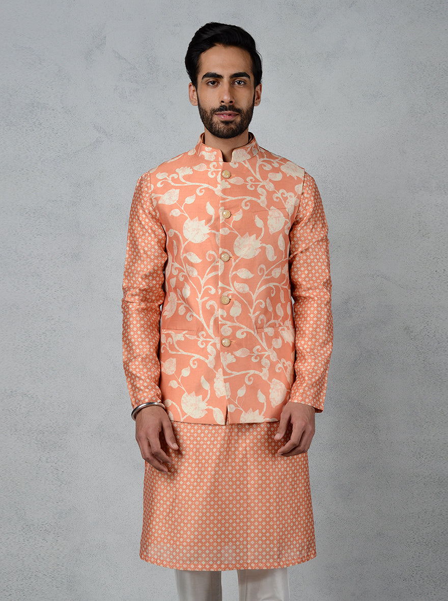 Orange Jodhpuri jacket in muga silk with monochrome floral print and mandarin collar, perfect for any event.