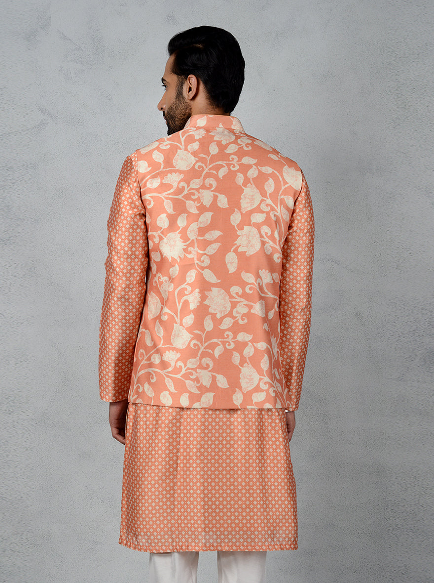 Unique orange muga silk bandhgala jacket featuring a mandarin collar and pearl button accents, perfect for events.