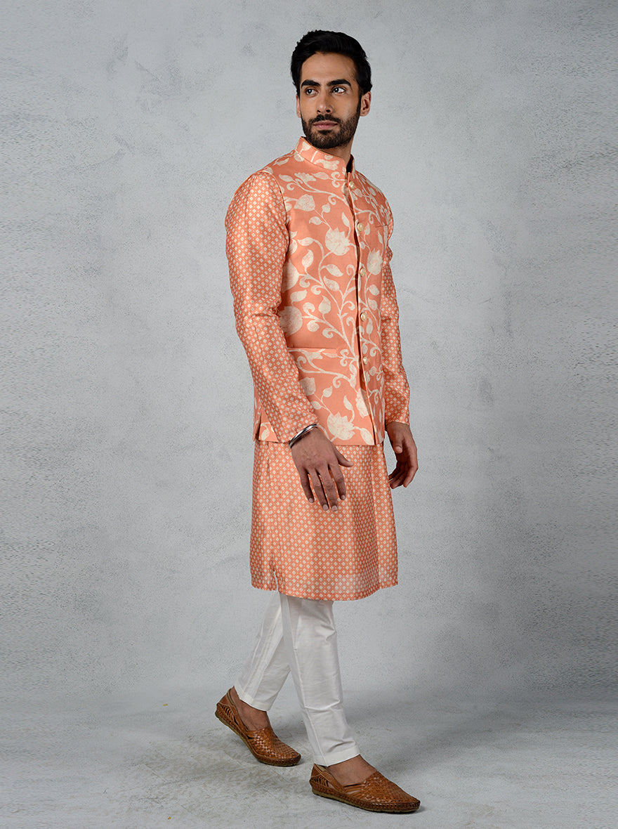 Elevate your style with this orange Jodhpuri jacket, featuring a floral print and mandarin collar for a fashionable look.